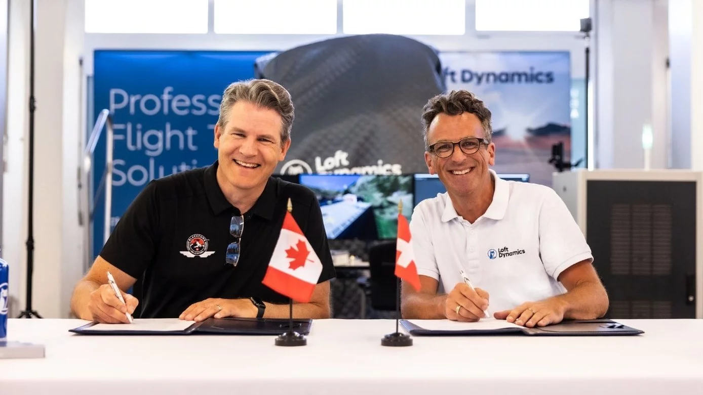 two men at the contract signing table