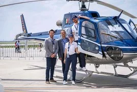 helicopter and team members