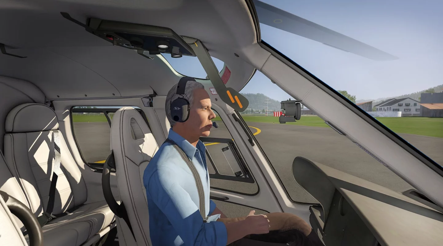 man in a helicopter cockpit flying