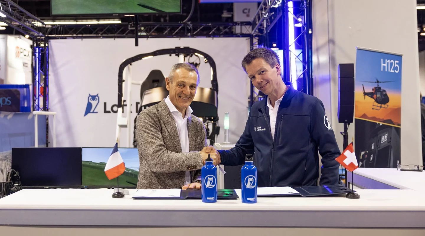 two men are shaking hands