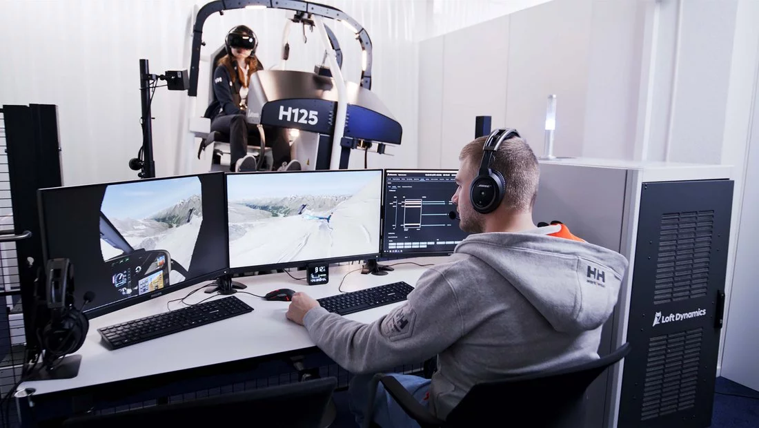 man at the working station with many monitors